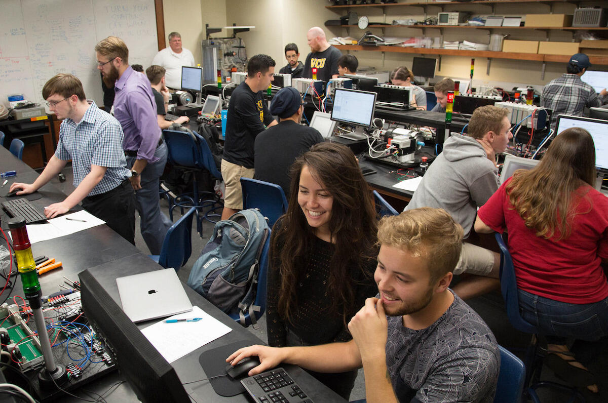 Students in the VCU School of Engineering’s Automation and Controls Lab set up programmable logic controllers, the specialized computers that operate industrial machines.
<br>Courtesy photo