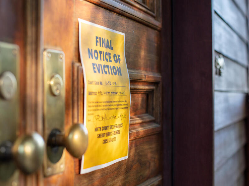 an eviction notice nailed to a door