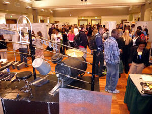 VCU’s first “Poster Symposium For Undergraduate Research & Creativity” brought out a steady crowd to look over the research projects and ask questions of the students who conducted the research. Photo by Mike Porter, VCU Communications and Public Relations.