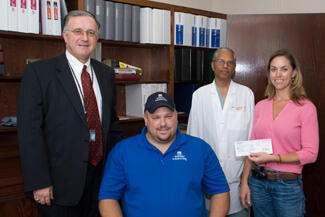 From left: John Duval, CEO of MCV Hospitals; Alan Bridgman, employee of Gerdau Ameristeel and former VCU Medical Center trauma patient; Rao Ivatury, M.D., professor in the Department of Surgery; and Kim Edwards, senior operations administrator for Gerdau Ameristeel.

Photo by Melissa Gordon, VCU Communications and Public Relations