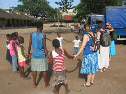 On the right, VCU students Jessica Secor, Susan Phipps, and Meredith Cofield participate in a weekly program where children who are homeless come to this center on Sunday to attend Sunday school. They also receive a free meal and first aid. The activities are sponsored by Sovereign Global Missions.

Photo by Stacey Reynolds
