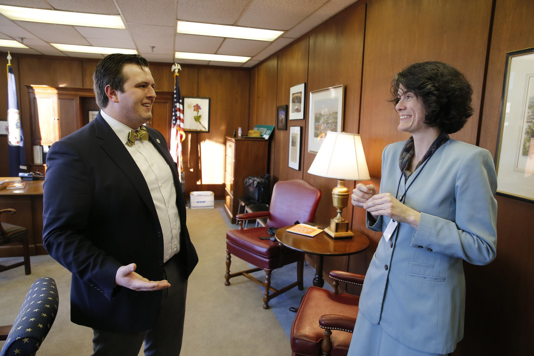 Brian Bailey confers with Erin Monaghan, legislative aide to House Minority Leader David J. Toscano.
