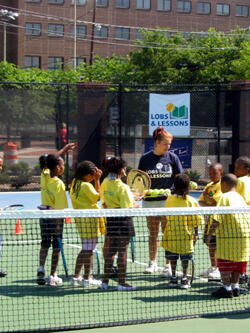 Lobs & Lessons staff members and volunteers teach children about tennis and offer significant life lessons too, such as teamwork and controlling emotions. Photo by Mike Porter VCU University Public Affairs 2008.