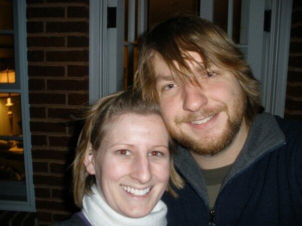 A woman and man smiling together.