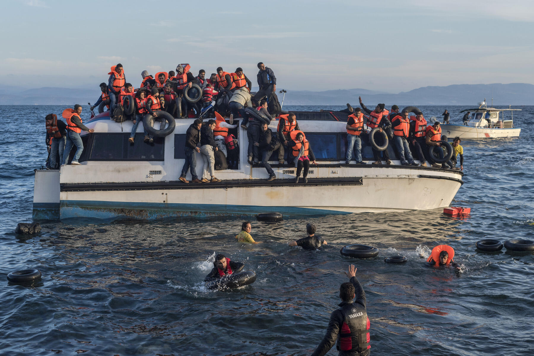 Syrian and Iraqi immigrants getting off a boat from Turkey on the Greek island of Lesbos.
<br>Ggia via Wikimedia Commons, http://creativecommons.org/licenses/by-sa/4.0/
