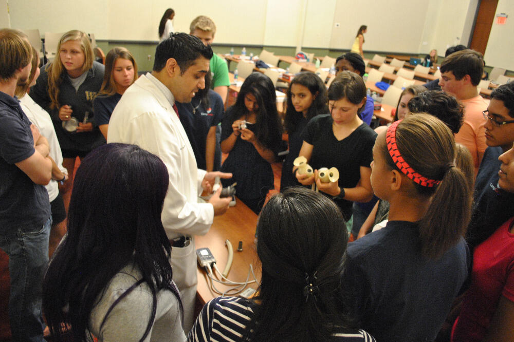Campers take an up-close look at the technology that powers artificial hearts with cardiology fellow Amit Varma, M.D., Ph.D. 