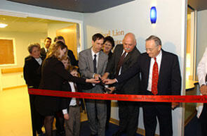 Dedicating VCU Medical Center's $2.3 million new pediatric intensive care unit. From left, Beth McCutcheon, community affairs, Food Lion; Ken Kuller, district operations, Food Lion; Doug Eley (background), Food Lion; Cindy Adkins, mother of former PICU patient; Mark Adkins, (background) district manager for Food Lion, Richmond and father of former PICU patient; Sarah Adkins; Reece Adkins, former PICU patient; Dr. Sheldon Retchin, VCU vice-president for health sciences and CEO of the VCU Health System; Rita Roberson, community affairs, Food Lion; Dwayne Gilley, vice-president for Food Lion's Northern Division, Dr. Eugene P. Trani, VCU President & chair of the VCU Health System official kick off a new era for pediatric critical care with the official dedication of the new unit.