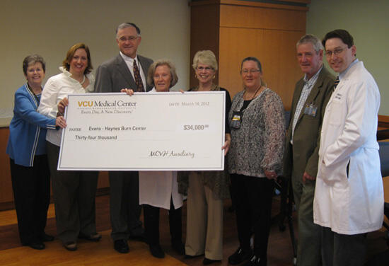 From left: Lois Trani, MCV Auxiliary; Traci Wakefield, nurse manager, Evans-Haynes Burn Center; John Duval, CEO, MCV Hospitals; Dr. Andrea Pozez, Evans-Haynes Burn Center; Jo Anne Burton, Valli Duvall and Rick Dodson, MCV Auxiliary; Dr. Michael Feldman, Evans-Haynes Burn Center
