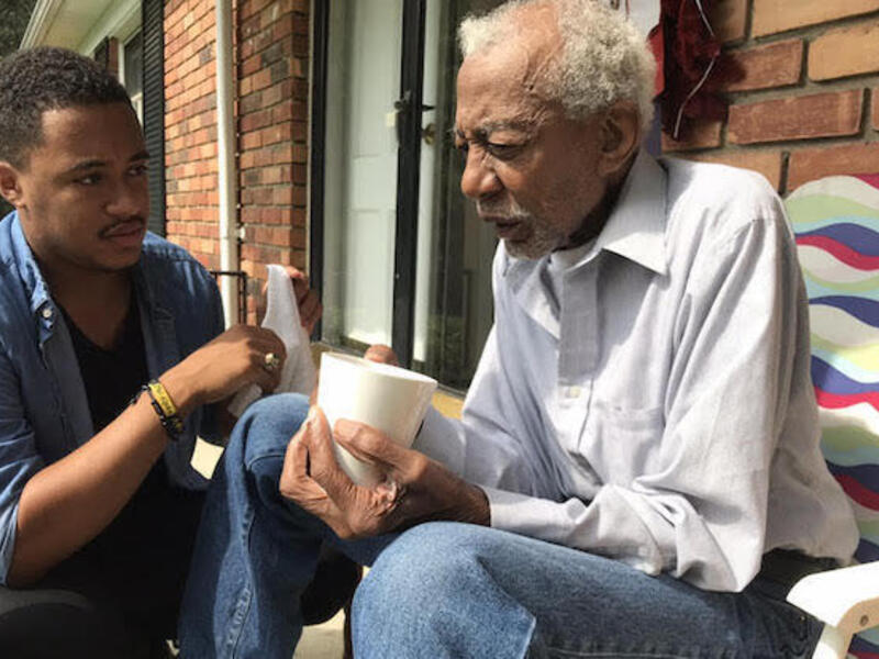 Jordan Howard Thomas, left, with his grandfather, Howard Belton.