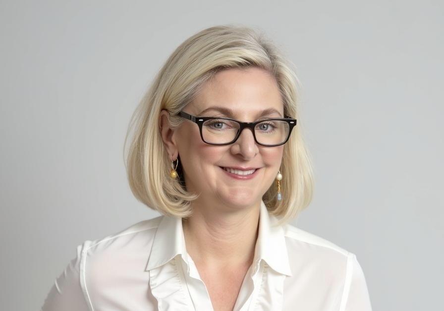 A photo of a woman from the shoulders up.