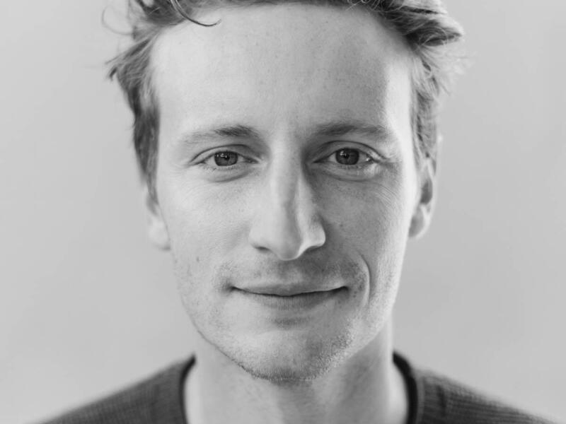 A photo of a man from the shoulders up. 