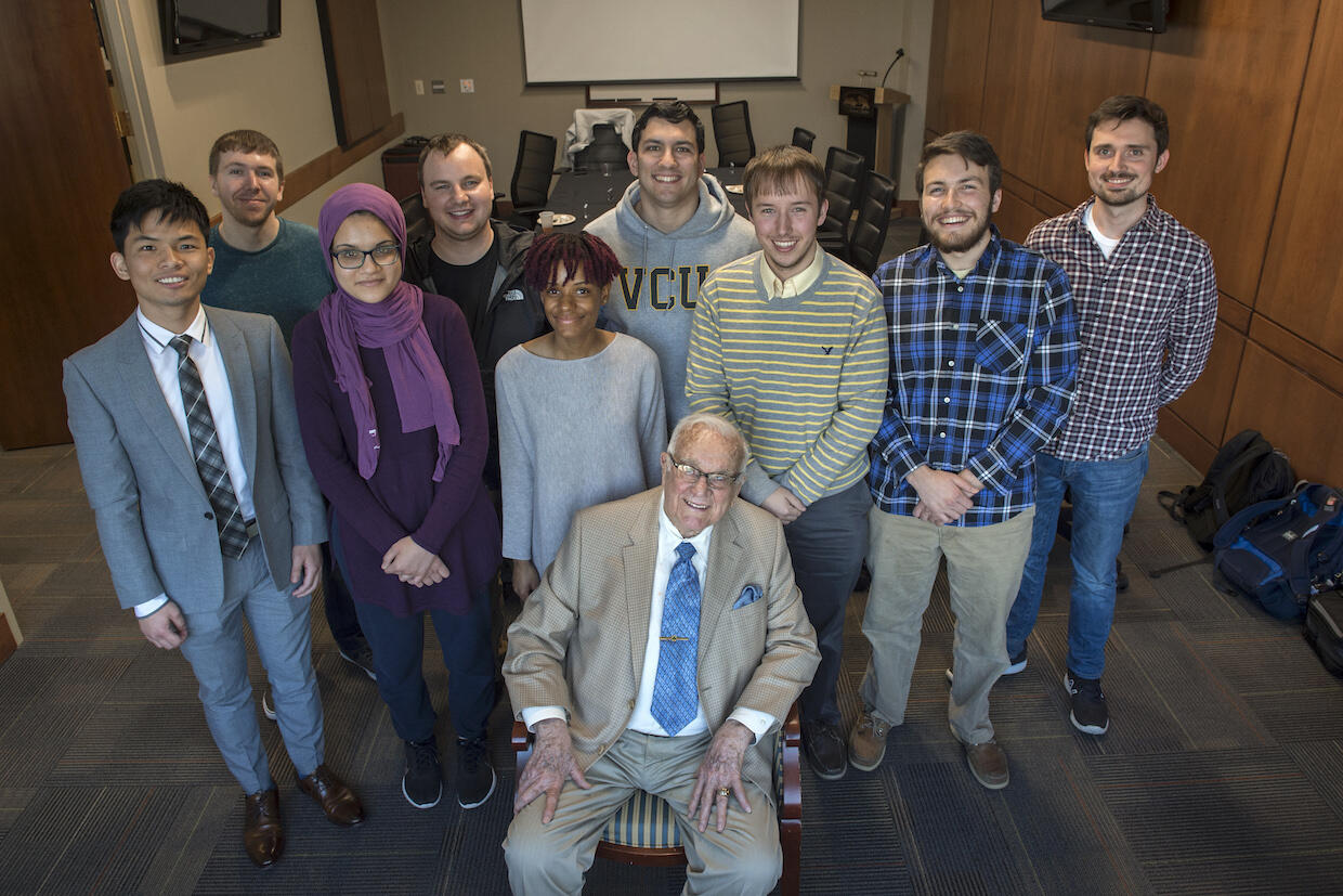 Kenneth Wright, sitting in front of a group of VCU students.