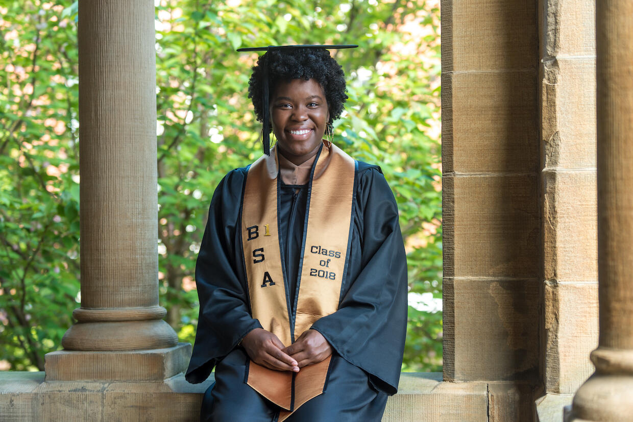 Tammie Goode plans to fasten her baby shoes to her graduation mortarboard. "Red velcro shoes, smaller than a smartphone," she said. "When I was little and my parents and I would go somewhere, I would get so excited that I would usually put the shoes on backwards or on the wrong foot." (Photo credit: Kevin Morley)